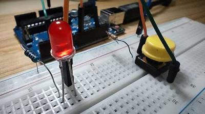 Using Simple Pushbutton Switches to Light Up LEDs